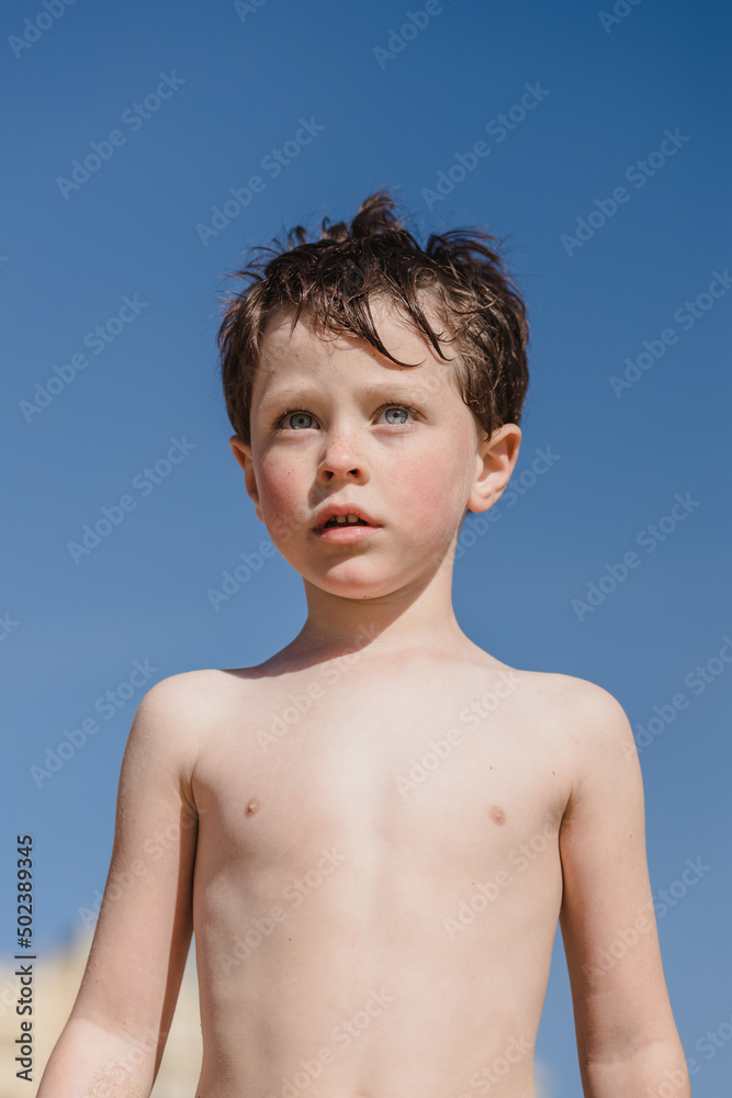 Curious Shirtless Boy On Shore Stock Photo Adobe Stock