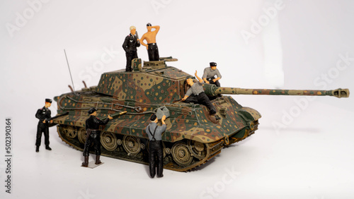Scene from a diorama with miniature soldiers sitting on their tank