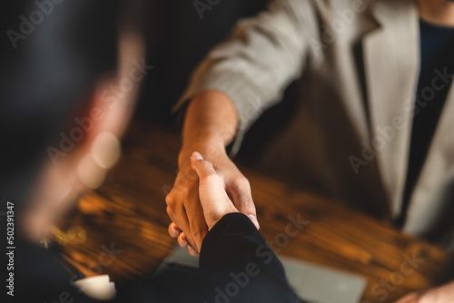 business hand contract meeting with success agreement concept, professional businessman handshake in modern office with cooperation person team, teamwork partnership deal and greeting