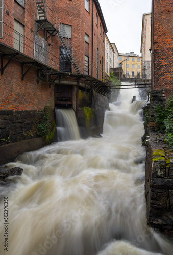 Vertical shot of the stream of the river in Kvarndammen i Molndal photo