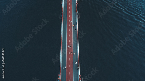 Beautiful aerial view of cars on a highway Darnytskyi bridge in the Dnieper river in Kyiv, Ukraine photo