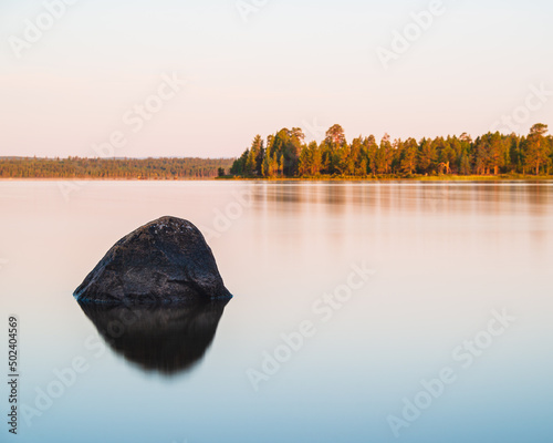 Photography Stone lying in still lake, Sweden