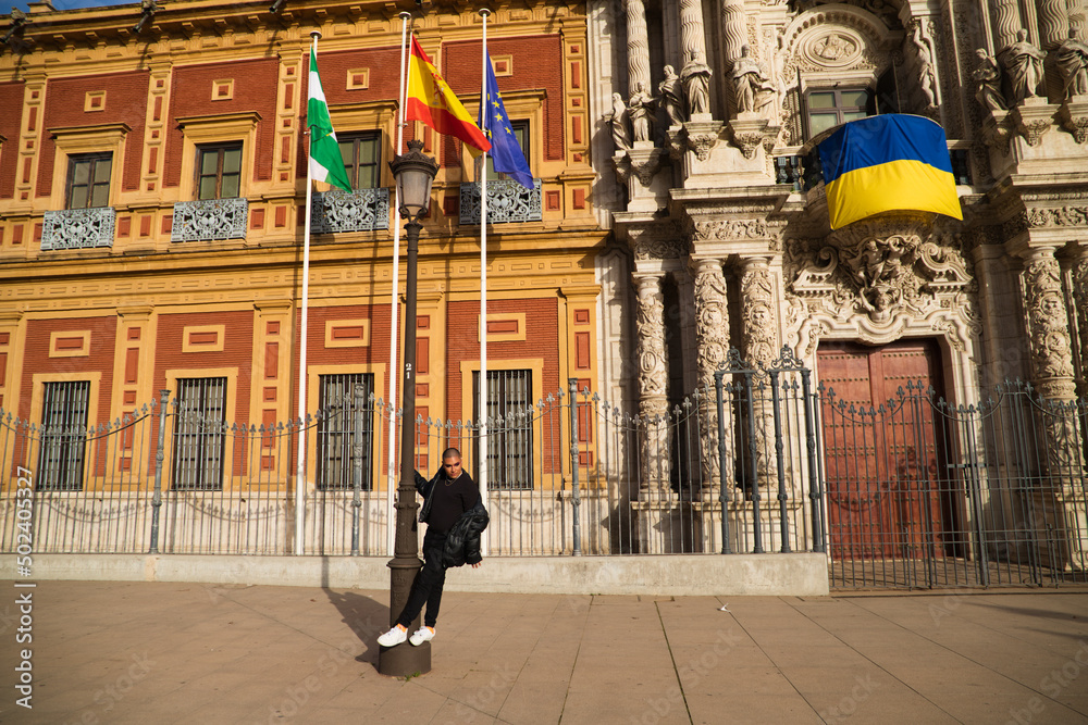 Non-binary person, of South American origin and young, the person is a make-up artist and poses for photos while travel in Europe. Concept equality, homosexuality, gay, lesbian, transgender, gay pride