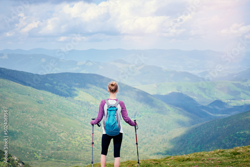 Active lifestyle. Traveling, hiking and trekking concept. Young woman with backpack in the Carpathian mountains.