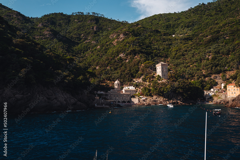 SAN FRUTTUOSO, ITALY - JULY 2021: The ancient monastery on the coastline of Liguria region. near Portofino SAN FRUTTUOSO, ITALY - JULY 2021: The ancient monastery on the coastline of Liguria region. near Portofino