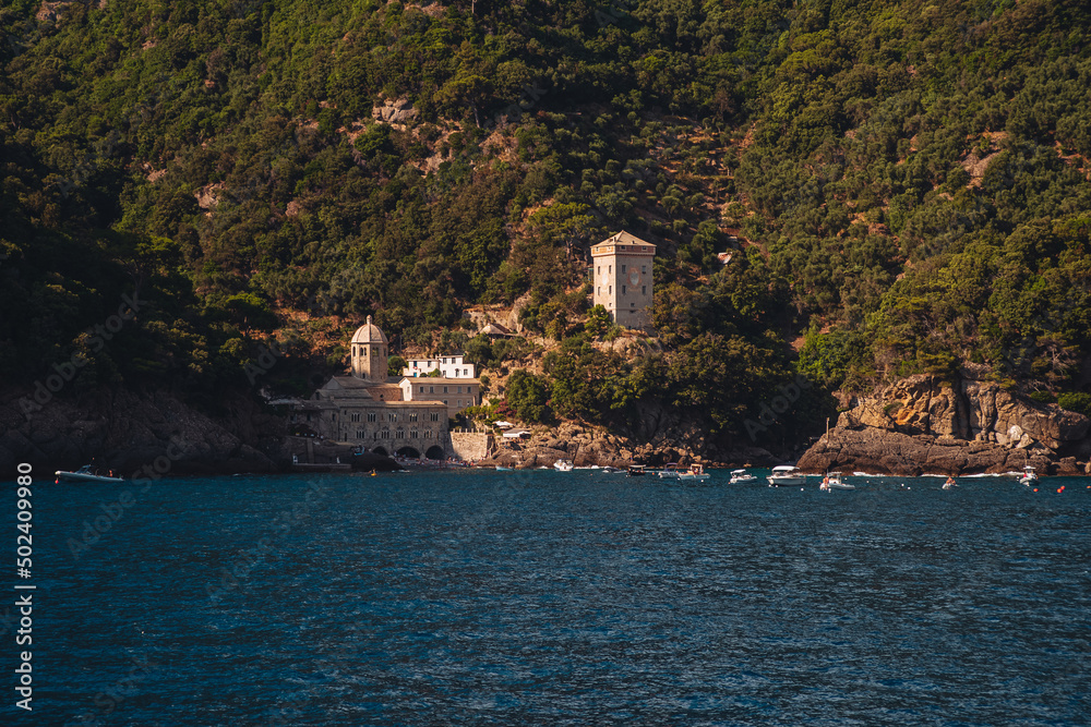 SAN FRUTTUOSO, ITALY - JULY 2021: The ancient monastery on the coastline of Liguria region. near Portofino