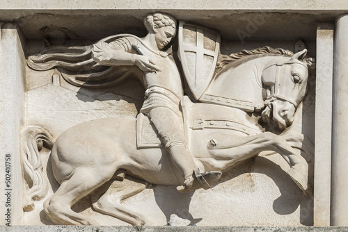 Closeup of a carving of Saint Chrysogonus on Narodni trg in Zadar, Croatia under the sun photo