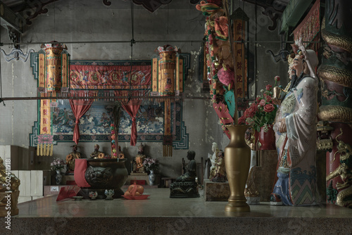 Bangkok, Thailand - Apr 29, 2022 : Architecture interior of Traditional chinese shrine and Chinese god statues on Chinese altar table at Phutthamonthon sathan or Sun wukong shrine. Selective focus. photo