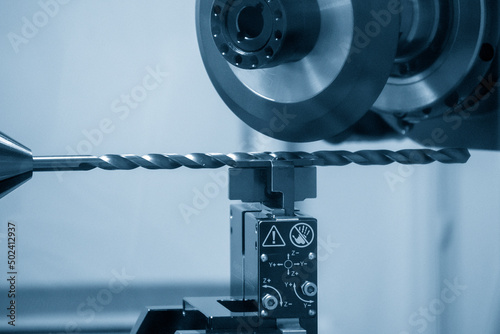 The drilling tool regrinding process with abrasive wheel.