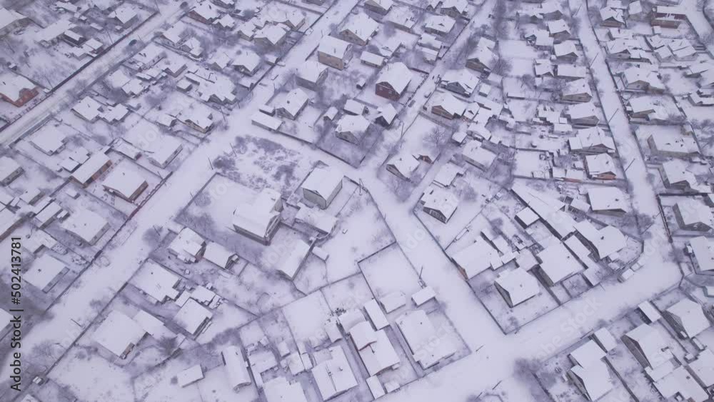 Aerial view of the ukrainian snow village with private houses and garden plots at winter time. Shooting from a drone. Ukraine, Eastern Europe Aerial view of the ukrainian snow village with private houses and garden plots at winter time. Shooting from a drone. Ukraine, Eastern Europe
