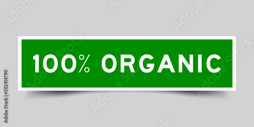 Sticker label with word 100 percent organic in green color on gray background