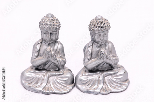 Oriental Asian female Statues isolated on a White Background photo