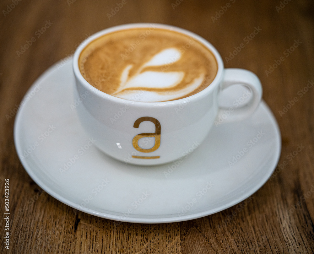 cup of cappuccino on a wooden table cup of cappuccino on a wooden table