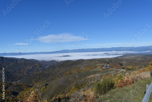 Nature of Ponferrada (El Bierzo) from Bouzas road on a sunny, foggy day in Spain photo