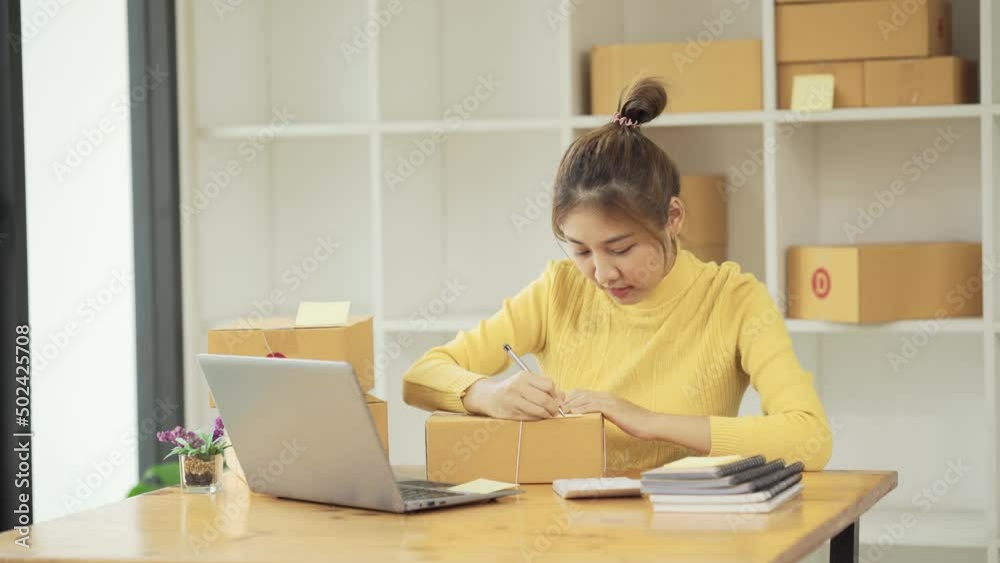 Starting small businesses SME owners female entrepreneurs Use a laptop or notebook to receive and review orders online to prepare to pack boxes, sell to customers, SME online business ideas. Starting small businesses SME owners female entrepreneurs Use a laptop or notebook to receive and review orders online to prepare to pack boxes, sell to customers, SME online business ideas.