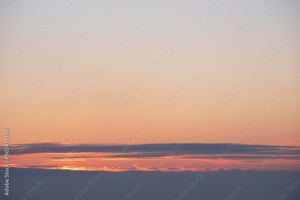 Sunrise in the sky with clouds.