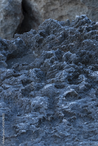Canvastavla Vertical shot of a textured rocky surface in Costa Brava