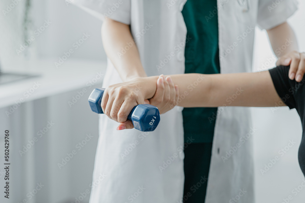 Physiotherapist is doing physical therapy for a patient, the patient has body aches due to overwork and has undergone treatment and physiotherapy with a professional physiotherapist.