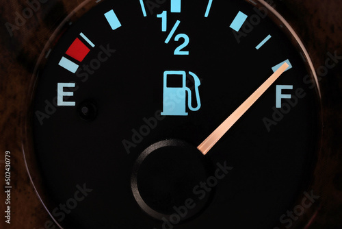 fuel gauge in car dashboard in illuminated night mode  - full