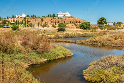Marsh of Castro Marim and Vila Real de Santo António in Portugal, with the ravelin and the chapel of Santo António in the background, on a sunny day in summer. photo