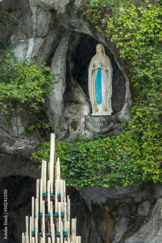 Fotografie, Obraz Statue of Virgin Mary in the grotto of Our Lady of Lourdes, France