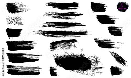 Short and long strokes with a dry brush. Grunge textures. A collection of vector black brushes isolated on a white background. Abstract modern forms of lines.