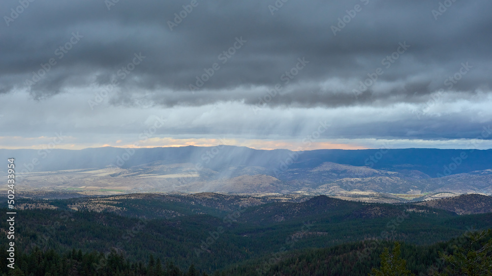 Rainy clouds above the mountain forest in Eastern Oregon.