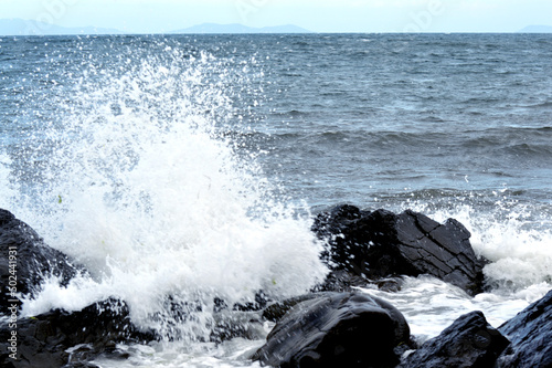 Beautiful romantic photo, seashore on the beach. Relaxing seascape. Waves with foam on the sea. Summer sunny day. Vacation spirit. Beautiful landscape. Nature background. 