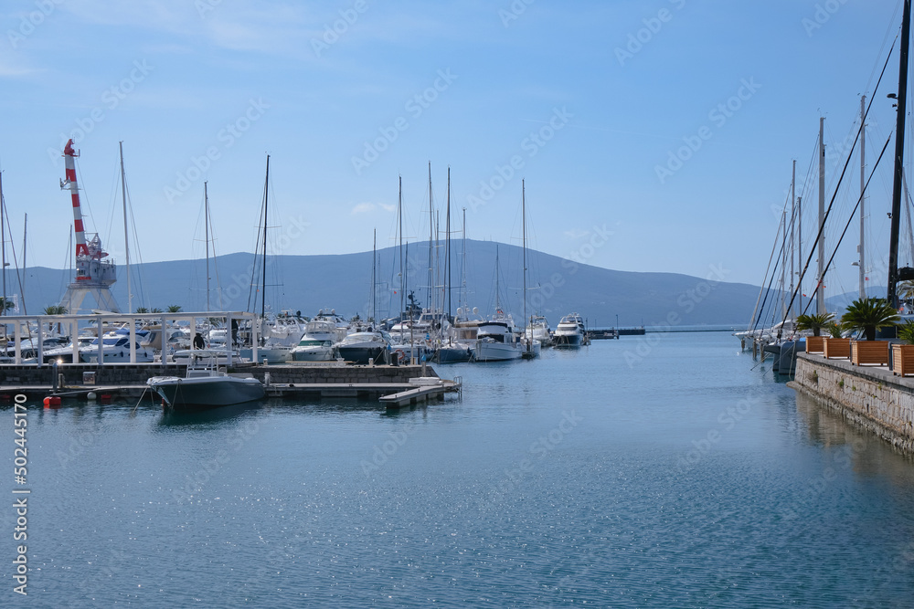 moored yachts in the harbour in Porto Montenegro calm sea. luxury hobby and leisure concept, sea transport, travel landscape