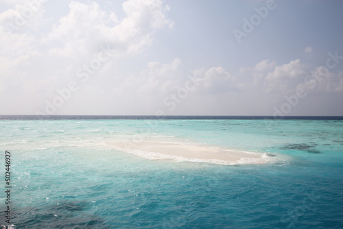 Maldives. Small island in the Indian Ocean. Blue sky and clean turquoise water. © Olga V