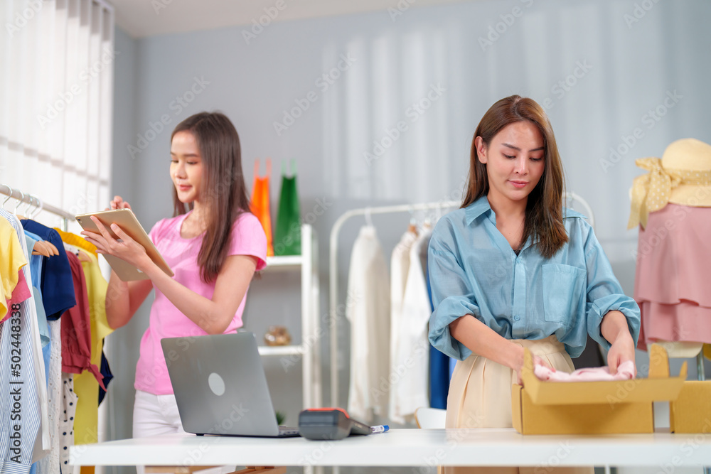 Young business owner working and selling online product and prepare packaging for the customer order. Young business owner working and selling online product and prepare packaging for the customer order.