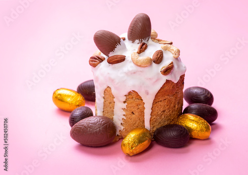 Easter holiday. Easter bread decorated with icing and chocolate eggs