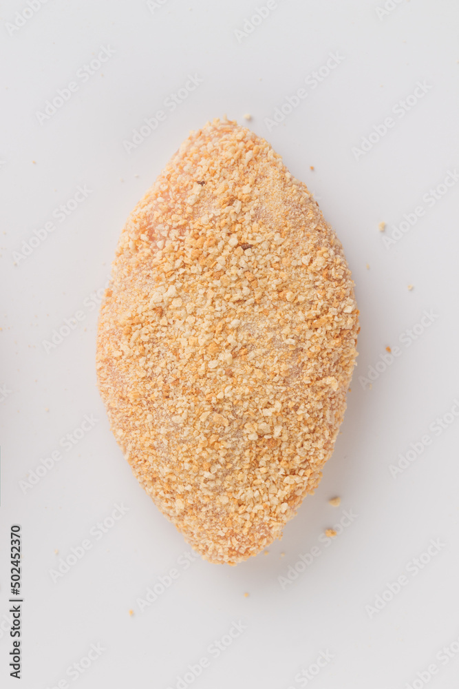Raw beached meat cutlet isolated on a white background Raw beached meat cutlet isolated on a white background