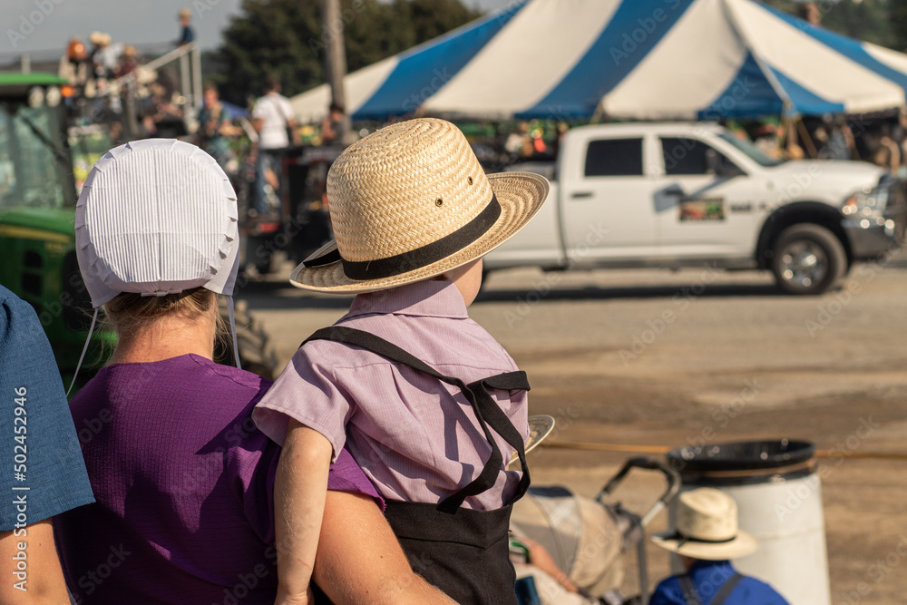 Amish Mother and Child at a Tractor Pull Event | Holmes County, Ohio Amish Mother and Child at a Tractor Pull Event | Holmes County, Ohio