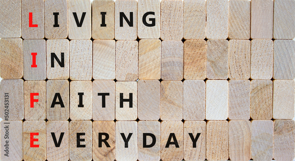 LIFE living in faith everyday symbol. Concept words LIFE living in faith everyday on wooden blocks on beautiful wooden background. Business LIFE living in faith everyday concept. Copy space. - obrazy, fototapety, plakaty 