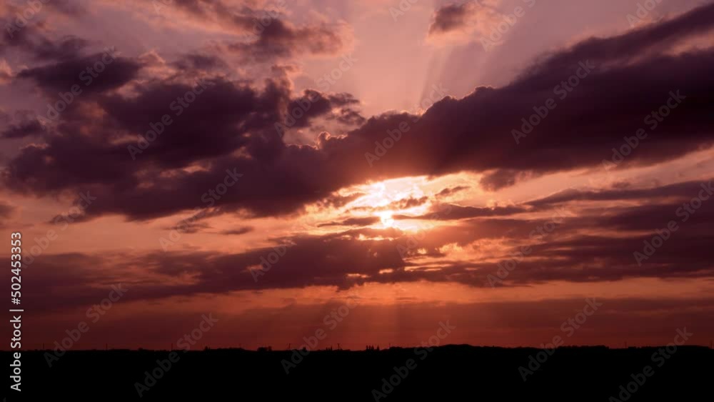 Beautiful Dramatic Sun Dawn Sunrise Colorful Rainy Sky and Clouds in Field in Stormy Weather, Time Lapse. Violet Orange Pink Dawn of Rising Sun in Storm Timelapse. Beautiful Dramatic Sun Dawn Sunrise Colorful Rainy Sky and Clouds in Field in Stormy Weather, Time Lapse. Violet Orange Pink Dawn of Rising Sun in Storm Timelapse.