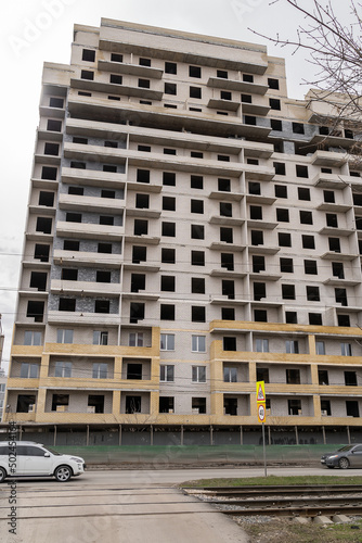 Construction of a new large multi-storey brick apartment building in the city.