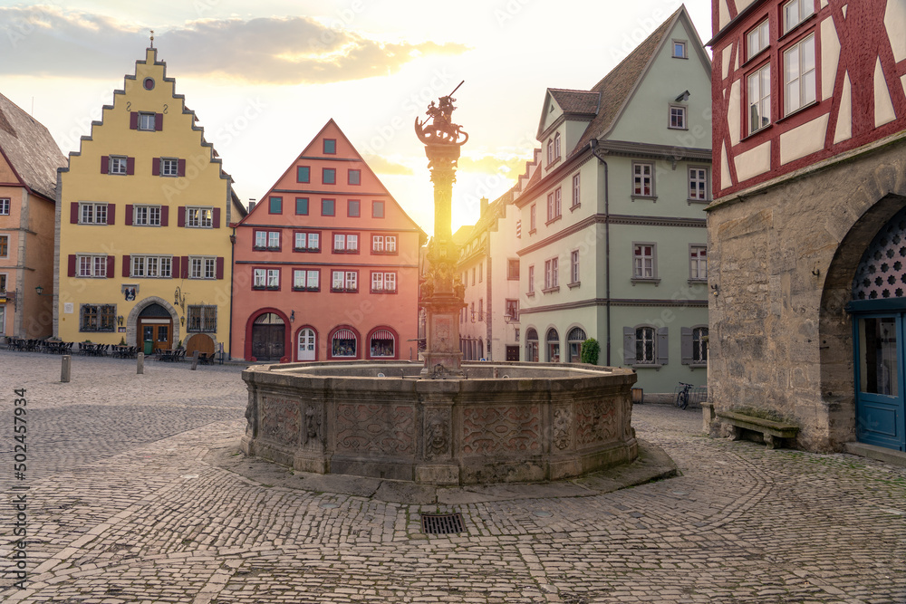 morning with sunrise in Rothenburg ob der Tauber with colorful houses of market square