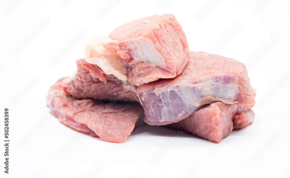 fresh Pile of beef cubes isolated on white.