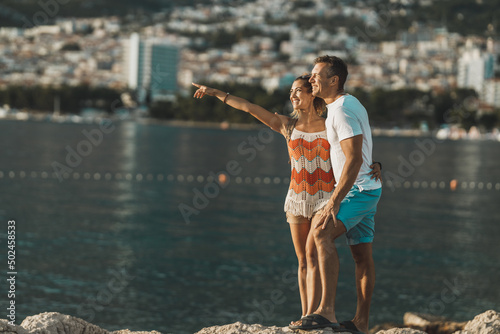 Couple Enjoying A Summer Vacation At The Mediterranean Coast