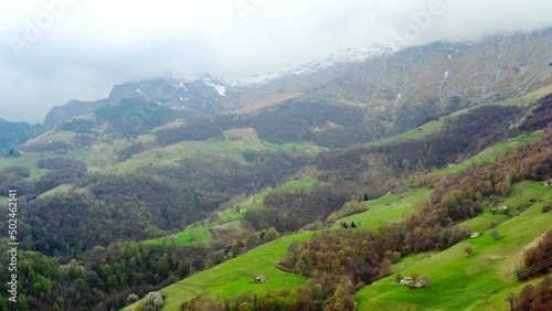 Aerial video of the small town of Pasturo in Lombardy, North Italy showing mountain panorama, forest and old cottages in the small village. Footage 4k, drone view photo