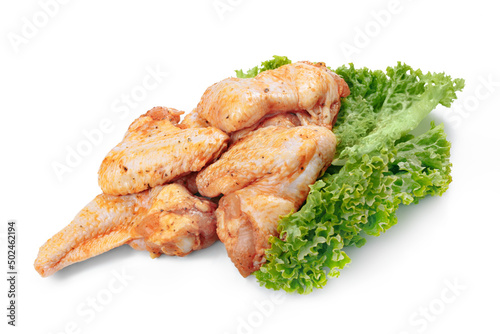 Marinated chicken wings on a white background. Meat for Grill.