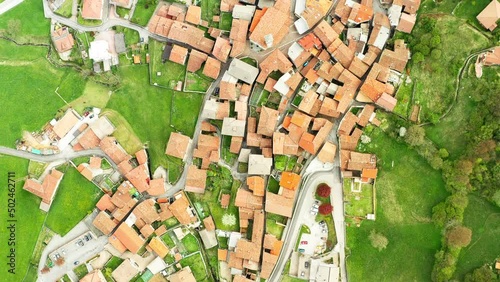 Aerial landscape with alpine village houses. Video of the small town of Pasturo in Lombardy, North Italy showing cottages from above. Footage 4k, drone view photo