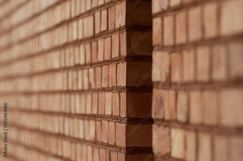 Fragment of a Brick wall - wall from red bricks - background, close-up Fragment of a Brick wall - wall from red bricks - background, close-up