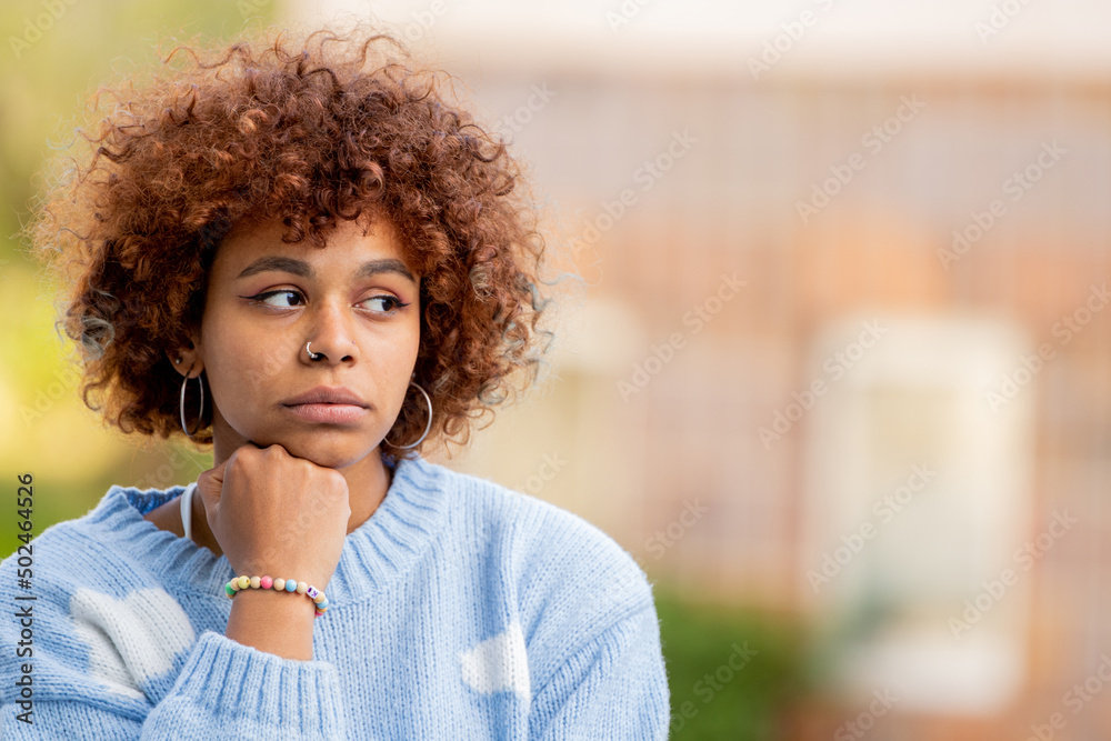 portrait of pensive african american girl on the street outdoors portrait of pensive african american girl on the street outdoors
