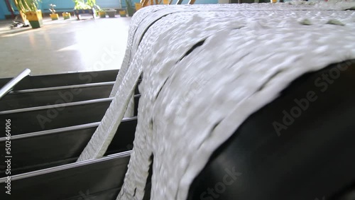 Stages of Carbon Fiber Manufacturing at the Factory. Artificial Synthetic Acrylic White Fibre Production Line at the Chemical Plant.