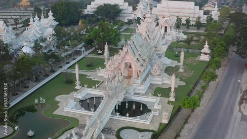 Aerial view of Wat Rong Khun, the white temple, at sunrise, in Chiang Rai, Thailand photo