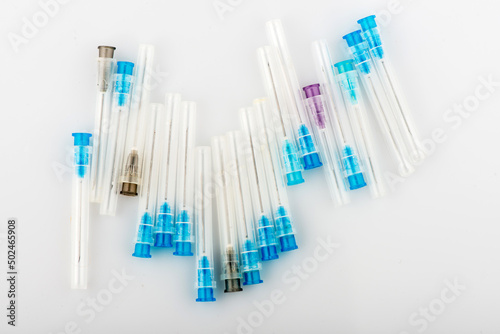 used medical syringes on a white background