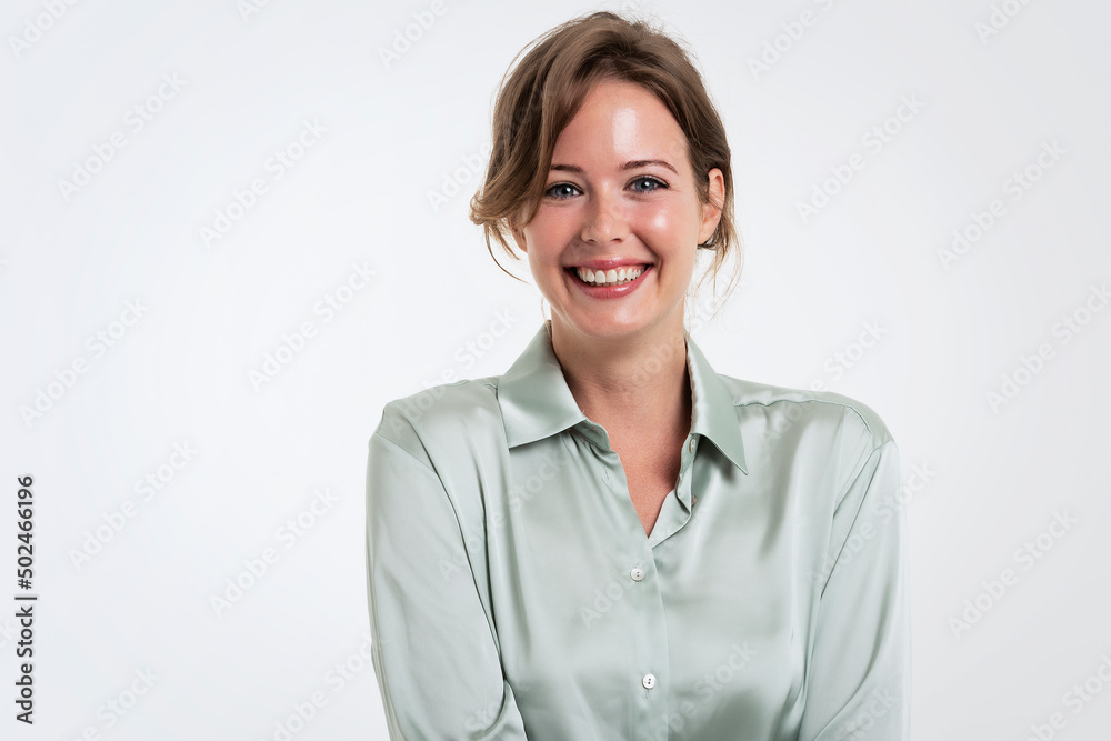Happy woman studio portrait while standing at isolated background Happy woman studio portrait while standing at isolated background