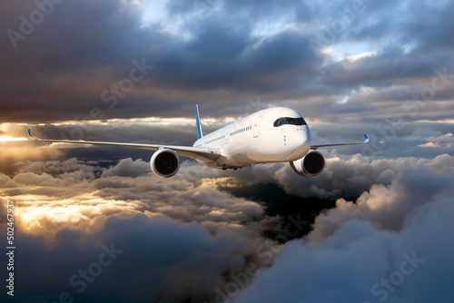 Passenger plane in the sky. Aircraft flying high above the storm clouds.